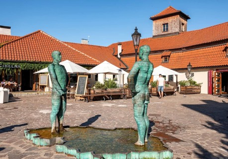 Two male figures peeing