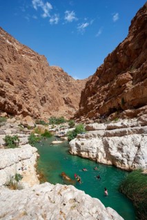 Freshwater pool between rugged cliffs