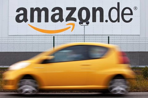 Yellow car in front of Amazon Logistics Center