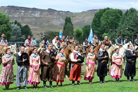 Dance group and riders sing the national anthem at the opening ceremony