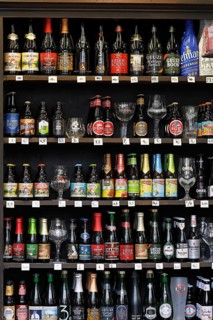 Shelf with assortment of Belgian beer in a beverage shop
