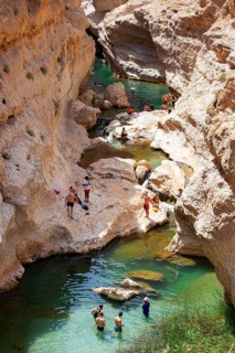 Freshwater pool between rugged cliffs