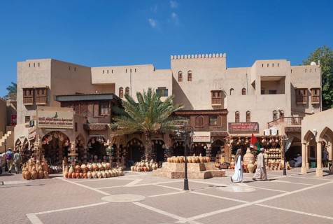 Clay jugs in front of souvenir shops