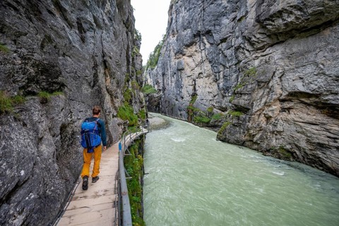 Young man hiking in the Aare gorge in the Haslital