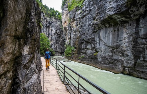 Young man hiking in the Aare gorge in the Haslital