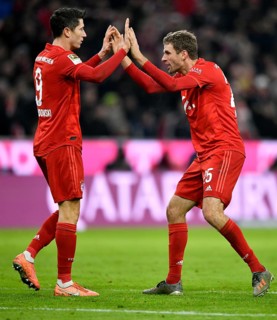 Goal celebration Thomas Mueller FC Bayern Munich with Robert Lewandowski FC Bayern