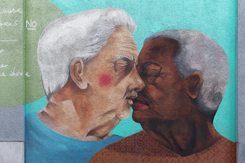 Two older gays kiss