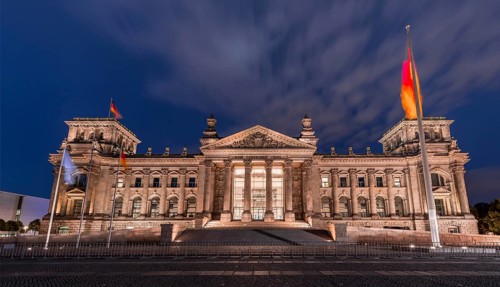 Reichstag with waving German flag