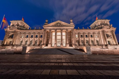 Reichstag with waving German flag