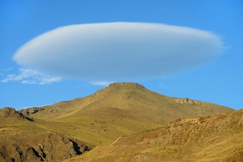 Lenticular cloud over bare mountain