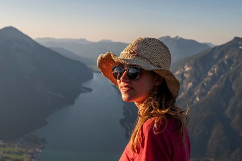 Young woman with sunglasses and sun hat