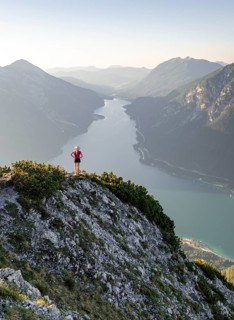 Young woman looking over mountain landscape