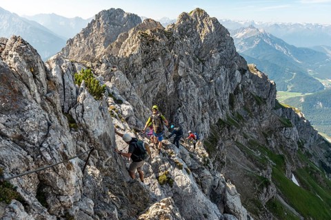 Mountaineer on a secured fixed rope route