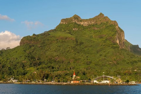 Village of Vaitape on the volcanic cone Mont Otemanu