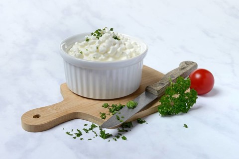 Cream cheese with parsley in bowl