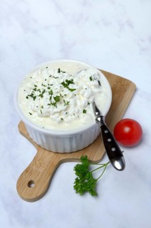 Cream cheese with parsley in bowl