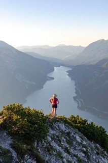 Young woman looking over mountain landscape