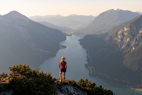 Young woman looking over mountain landscape