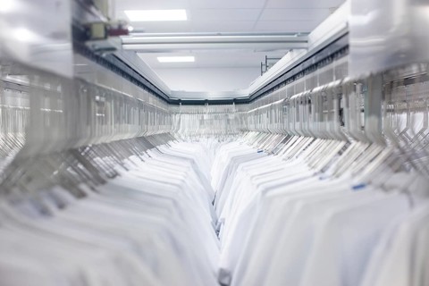Doctor's coats after cleaning hang in the wardrobe at the hospital