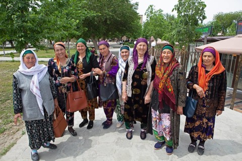 Visitors in traditional costume in the garden of the Bolo Hovuz Mosque