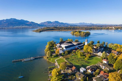 Steam jetty and Benedictine monastery Frauenwoerth on Fraueninsel
