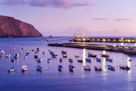 Fishing boats in the fishing port at dusk