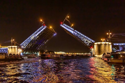 Opened Palace bridge over the river Neva at night