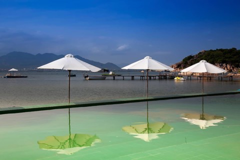 Swimming pool with parasols