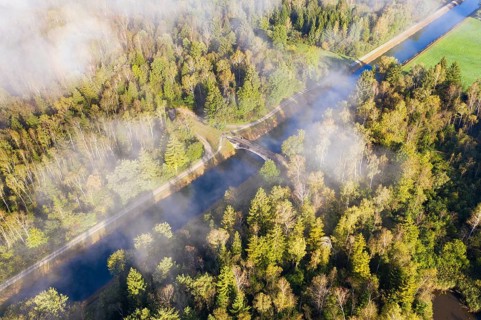 Wafts of fog over the Isar-Loisach Canal near Geretsried