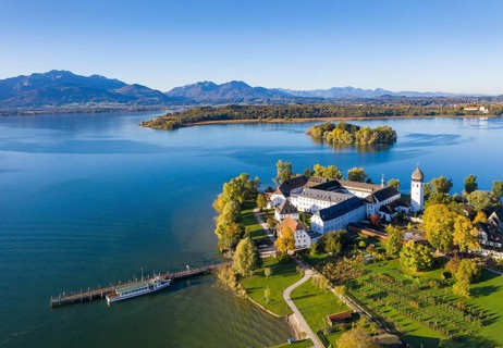 Steam jetty and Benedictine monastery Frauenwoerth on Fraueninsel