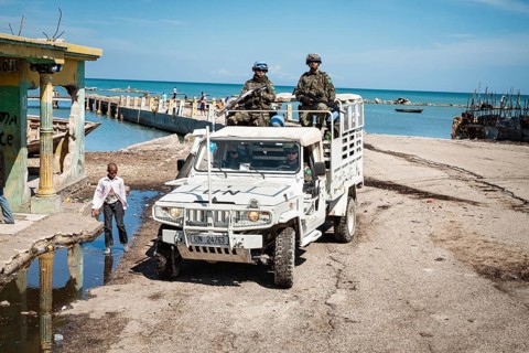 UN blue helmets in jeep on patrol