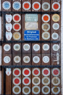 Barn door with many plaques