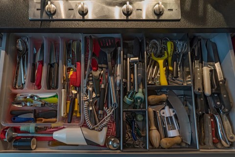 Drawer with many different kitchen utensils