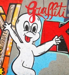 Colourful graffiti on a construction site barrier