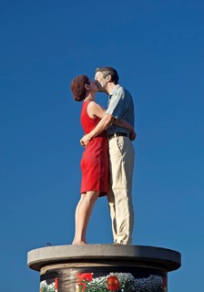 Sculpture Pillar saints couple II on an advertising pillar