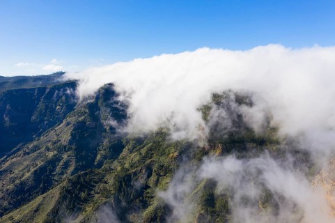 Trade wind clouds over the mountain ridge