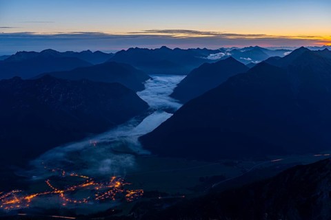 Sunrise over Lechtal Alps with fog in the valley