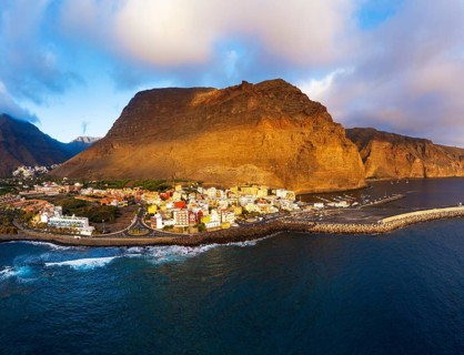 Vueltas with fishing harbour and mountain Tequergenche in the evening light