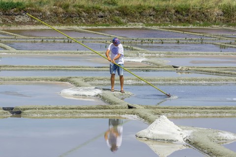 Man skimming salt