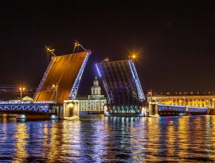 Opened Palace bridge over the river Neva at night