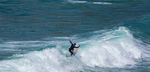 Surfers in the bay of Minou