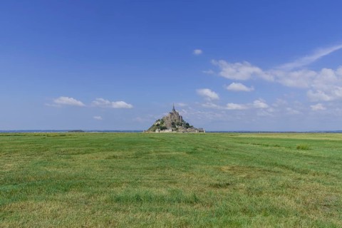 View over salt marshes to the Mont-Saint-Michel