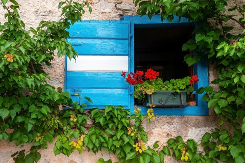 Blue and white shutter of a mountain hut