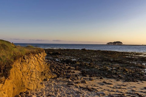 Coast in evening light with Pointe er Hourel in the background