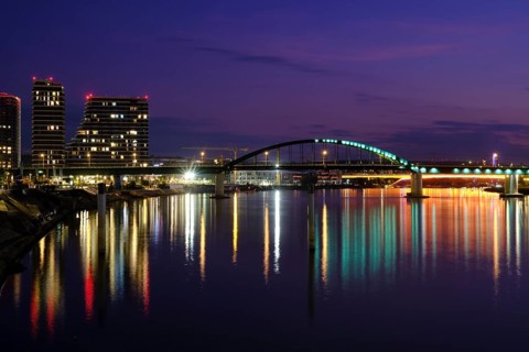 City view at night with water reflection
