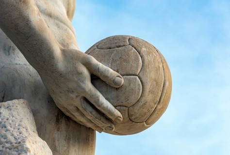 Athlete statue with a ball at Stadio dei Marmi