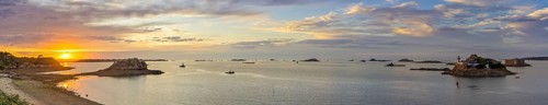 Sunset at Plage Tahiti and lighthouse on the Ile Louet and Chateau du Taureau