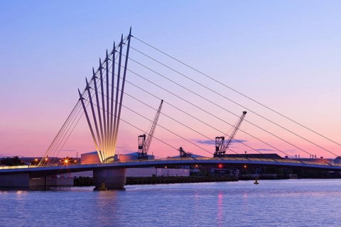 Media City footbridge and victorian cranes in afterglow