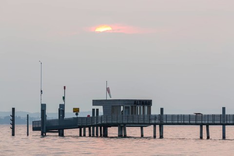 Longest jetty at Lake Constance in the morning light in Altnau