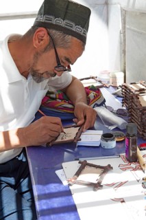 Writer writes in ancient oriental languages on leather